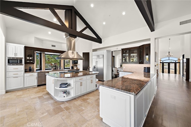 6 Via Presea, Coto De Caza, CA 92679 - kitchen featuring built in appliances, open shelves, a chandelier, a spacious island, and high vaulted ceiling