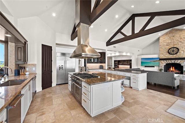 6 Via Presea, Coto De Caza, CA 92679 - kitchen featuring a sink, appliances with stainless steel finishes, high vaulted ceiling, stone tile flooring, and open floor plan