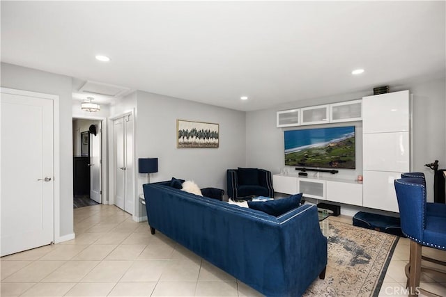 living area featuring baseboards, recessed lighting, and light tile patterned floors