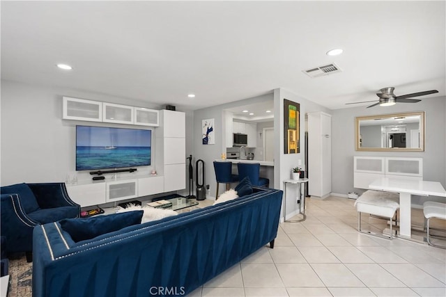 living area featuring ceiling fan, visible vents, recessed lighting, and light tile patterned floors
