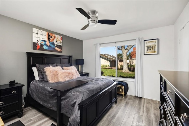 bedroom featuring light wood finished floors and ceiling fan