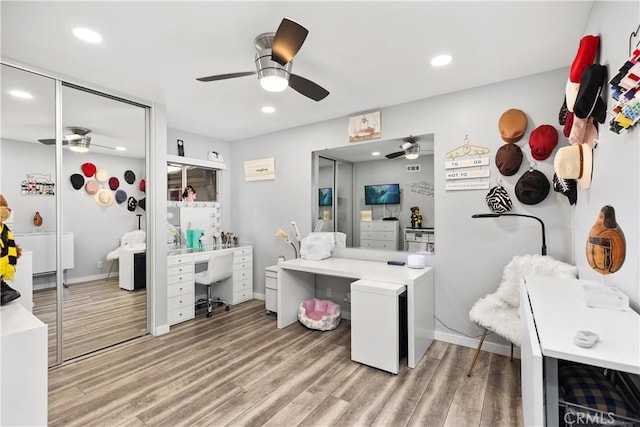 bathroom featuring recessed lighting, wood finished floors, and a ceiling fan