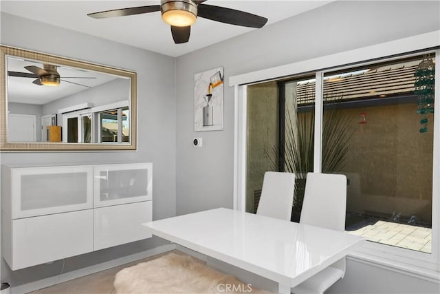 dining area with a ceiling fan