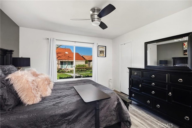 bedroom featuring light wood finished floors and ceiling fan