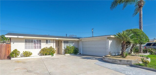 13602 Lanning St, Garden Grove, CA 92843 - ranch-style home featuring a garage, stucco siding, and concrete driveway