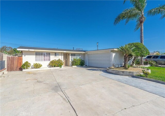 13602 Lanning St, Garden Grove, CA 92843 - ranch-style home with a garage, driveway, and stucco siding