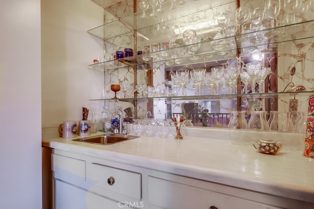 bar featuring wet bar and a sink
