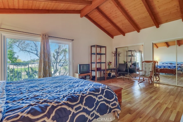 bedroom featuring wooden ceiling, beamed ceiling, wood finished floors, access to exterior, and high vaulted ceiling