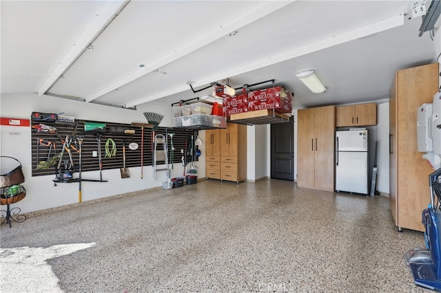 garage with freestanding refrigerator