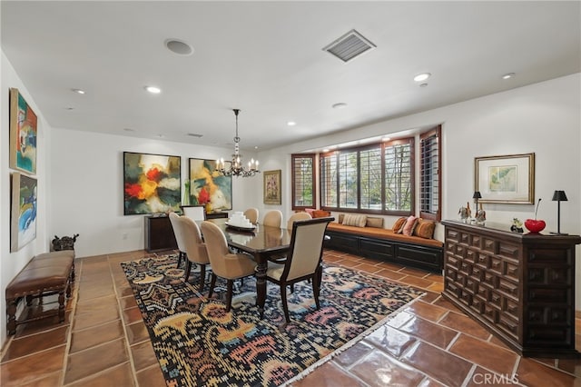 tiled dining area with recessed lighting, visible vents, and an inviting chandelier
