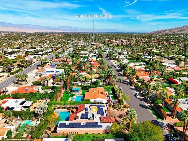 drone / aerial view featuring a residential view and a mountain view