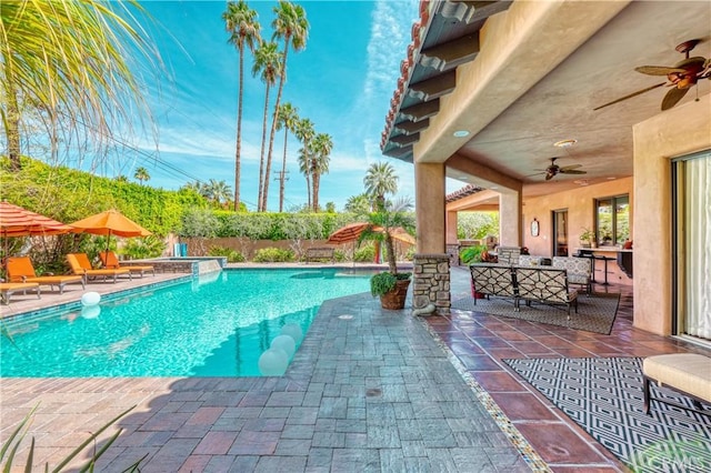 view of swimming pool featuring ceiling fan, a fenced backyard, a fenced in pool, and a patio