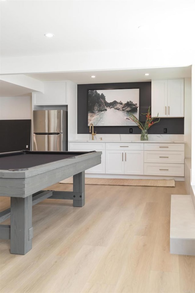 184246 S Pacific St, Oceanside, CA 92054 - rec room featuring light wood-style flooring, recessed lighting, and a sink