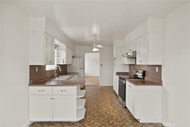 2909 Carlene Pl, Chico, CA 95973 - kitchen featuring stainless steel electric stove, open shelves, under cabinet range hood, and a sink