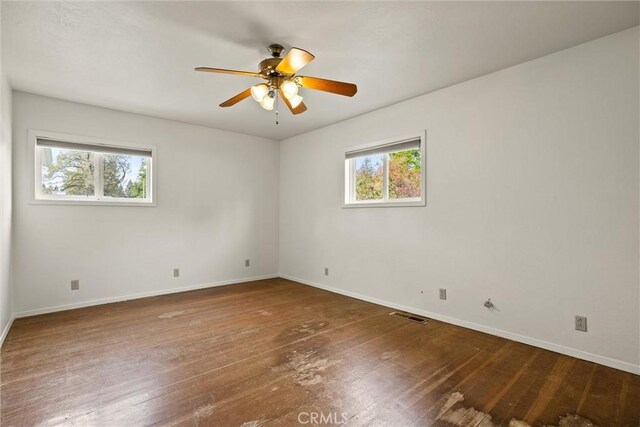 2909 Carlene Pl, Chico, CA 95973 - unfurnished room featuring baseboards, hardwood / wood-style floors, and ceiling fan