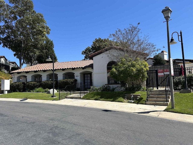 1714 Woodlark Ln, Fallbrook, CA 92028 - mediterranean / spanish-style home featuring a gate, stucco siding, and a tile roof