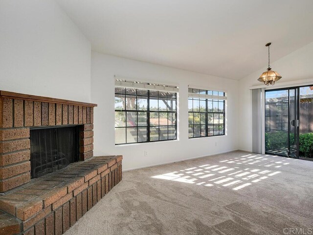 1714 Woodlark Ln, Fallbrook, CA 92028 - carpeted living area with a fireplace, lofted ceiling, and baseboards