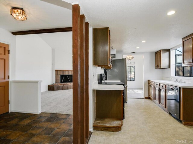 1714 Woodlark Ln, Fallbrook, CA 92028 - kitchen with dishwashing machine, light countertops, light colored carpet, a fireplace, and recessed lighting