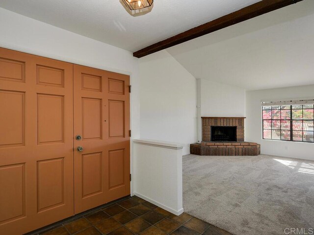 1714 Woodlark Ln, Fallbrook, CA 92028 - foyer entrance with a brick fireplace and dark colored carpet
