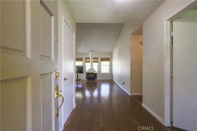 7320 Ramona Ave, Rancho Cucamonga, CA 91730 - hall featuring wood finished floors, baseboards, and a textured ceiling