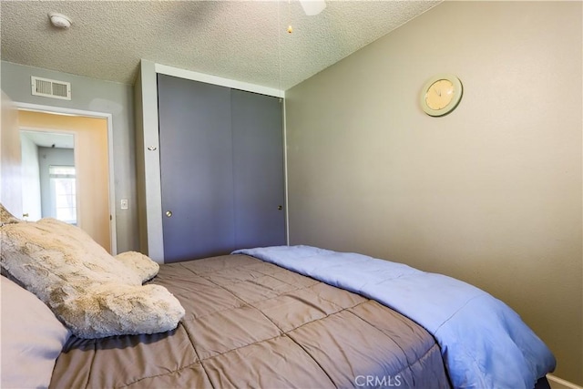 7320 Ramona Ave, Rancho Cucamonga, CA 91730 - bedroom featuring a closet and a textured ceiling