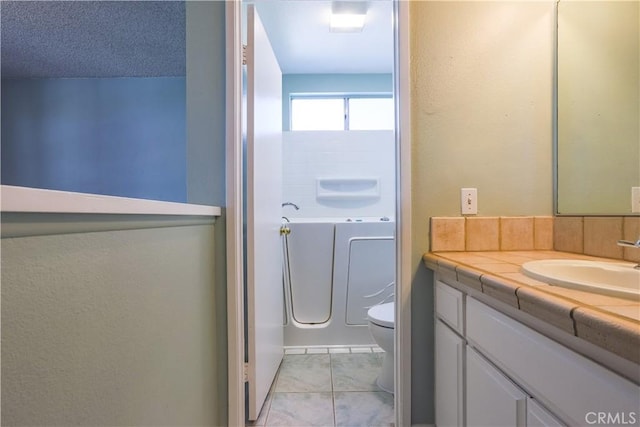7320 Ramona Ave, Rancho Cucamonga, CA 91730 - bathroom featuring vanity, a tub to relax in, and tile patterned flooring
