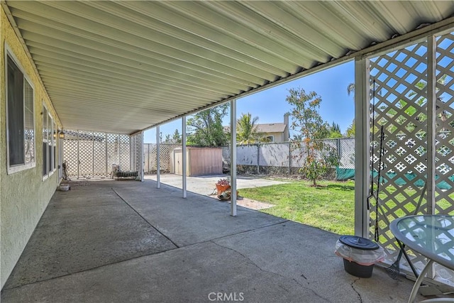 7320 Ramona Ave, Rancho Cucamonga, CA 91730 - view of patio with a storage unit, a fenced backyard, and an outdoor structure