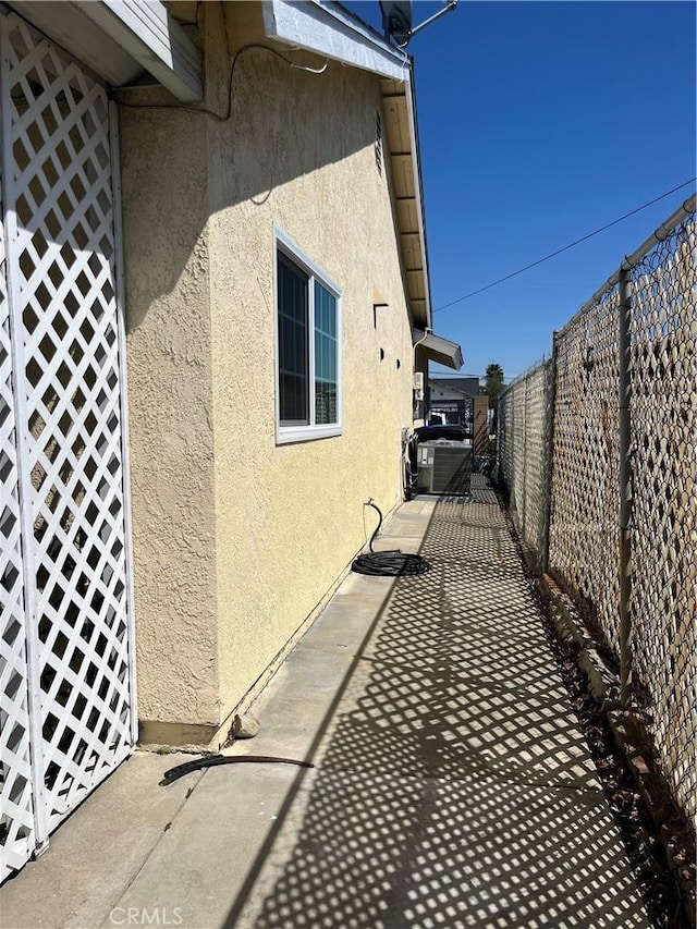 7320 Ramona Ave, Rancho Cucamonga, CA 91730 - view of side of home featuring stucco siding and a fenced backyard
