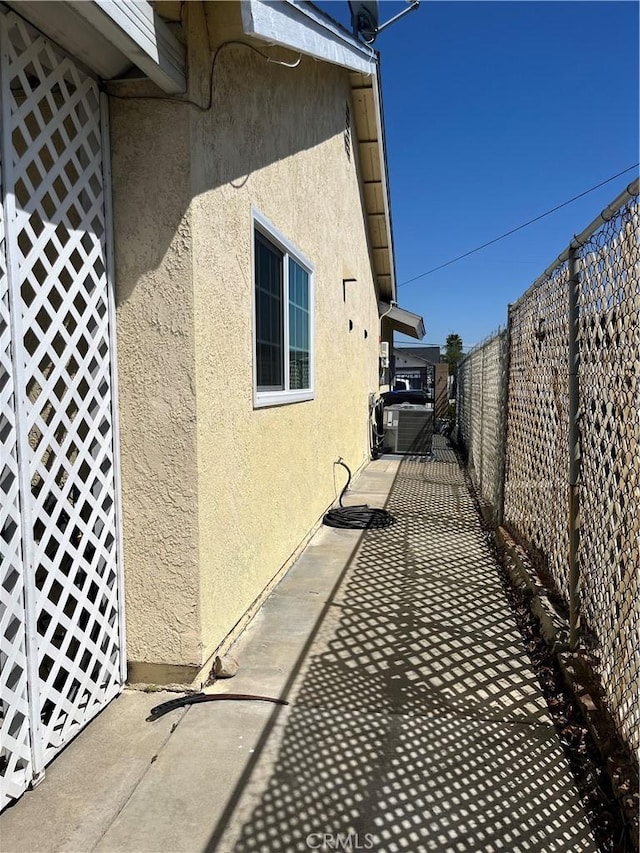 7320 Ramona Ave, Rancho Cucamonga, CA 91730 - view of side of home featuring stucco siding and a fenced backyard