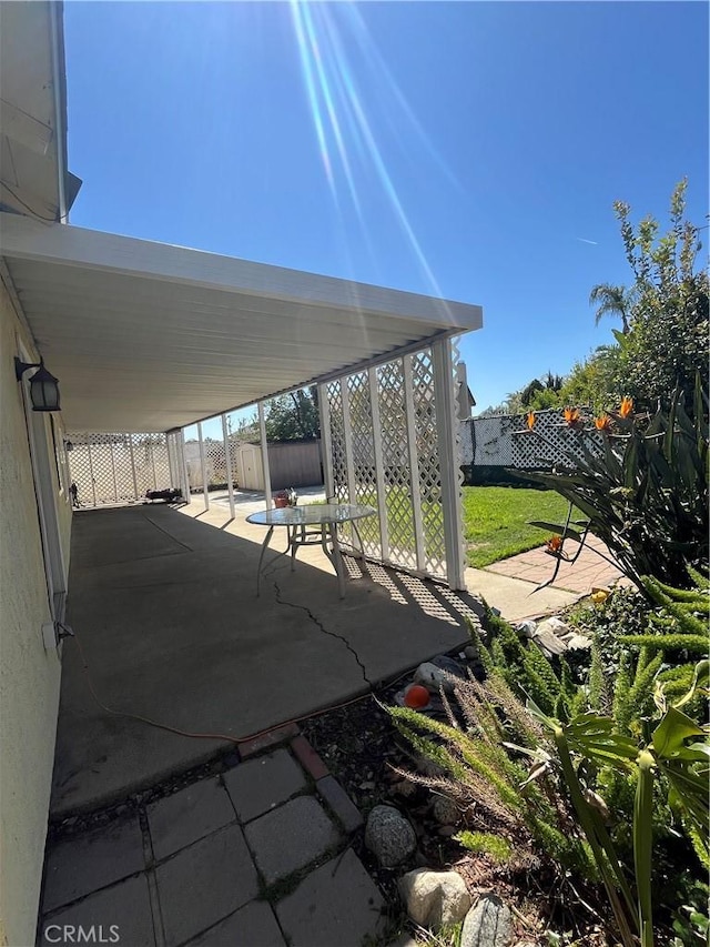 7320 Ramona Ave, Rancho Cucamonga, CA 91730 - view of patio / terrace with a shed, a fenced backyard, and an outbuilding