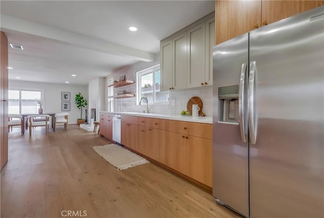 5039 W 135th St, Hawthorne, CA 90250 - kitchen featuring stainless steel fridge with ice dispenser, light countertops, tasteful backsplash, beamed ceiling, and light wood finished floors