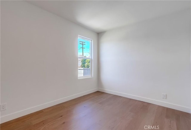 5039 W 135th St, Hawthorne, CA 90250 - empty room with wood finished floors and baseboards