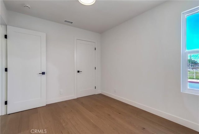 5039 W 135th St, Hawthorne, CA 90250 - unfurnished bedroom with wood finished floors and baseboards