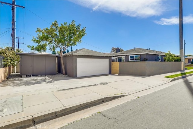 5039 W 135th St, Hawthorne, CA 90250 - ranch-style home with driveway, an outbuilding, and stucco siding