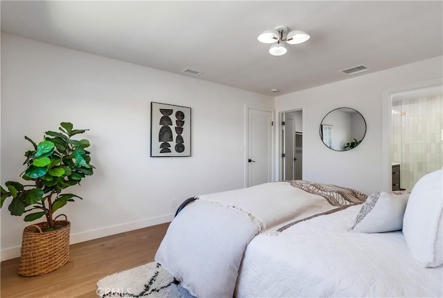 5039 W 135th St, Hawthorne, CA 90250 - bedroom with wood finished floors and baseboards