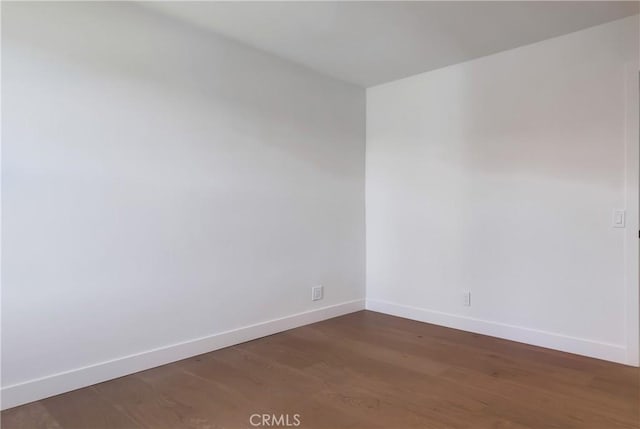 5039 W 135th St, Hawthorne, CA 90250 - unfurnished room with baseboards and dark wood-style flooring