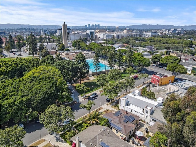 drone / aerial view featuring a mountain view and a view of city