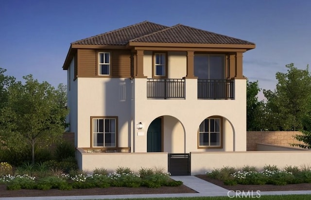 308 Terrapin, Irvine, CA 92618 - view of front of property featuring a fenced front yard, stucco siding, a balcony, and a gate