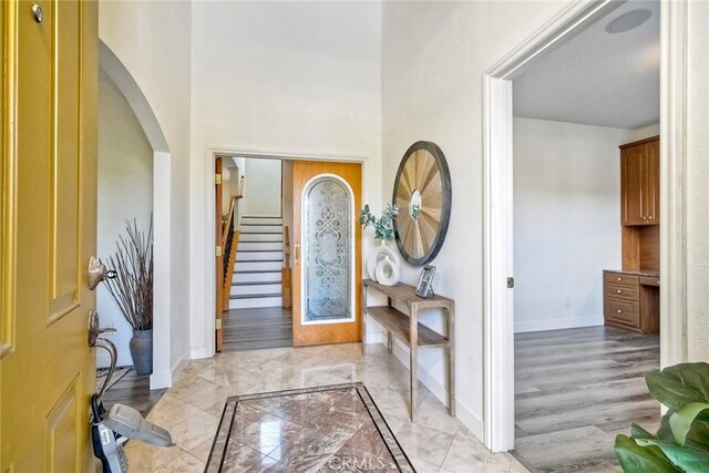 3184 Toopal Dr, Oceanside, CA 92058 - entryway with light marble finish floors, arched walkways, and stairs