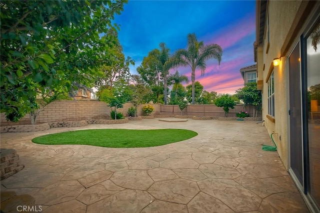 3184 Toopal Dr, Oceanside, CA 92058 - patio terrace at dusk featuring a fenced backyard and a patio area