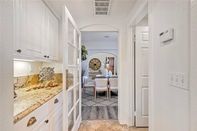 3184 Toopal Dr, Oceanside, CA 92058 - hallway with arched walkways and light tile patterned floors