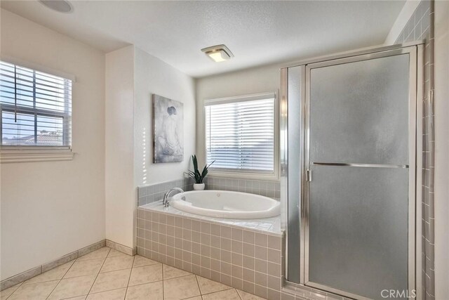 3184 Toopal Dr, Oceanside, CA 92058 - bathroom featuring tile patterned floors, a garden tub, plenty of natural light, and a shower stall