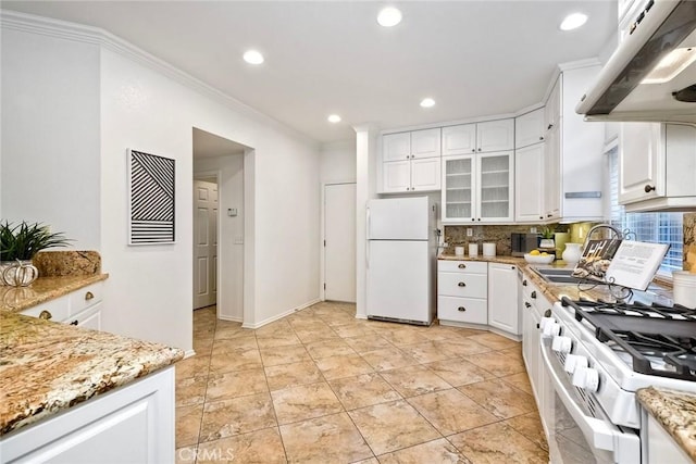3184 Toopal Dr, Oceanside, CA 92058 - kitchen with white appliances, under cabinet range hood, white cabinetry, decorative backsplash, and recessed lighting