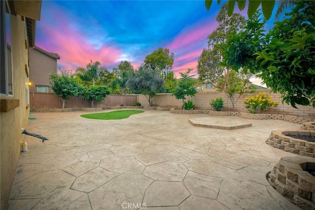 3184 Toopal Dr, Oceanside, CA 92058 - patio terrace at dusk with a fenced backyard and a patio area
