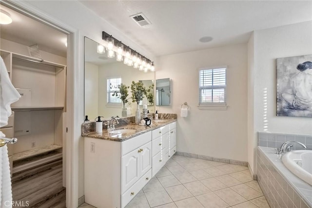 3184 Toopal Dr, Oceanside, CA 92058 - full bathroom with double vanity, a bath, tile patterned flooring, and a walk in closet