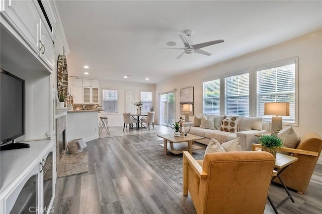 3184 Toopal Dr, Oceanside, CA 92058 - living area with a ceiling fan, recessed lighting, wood finished floors, ornamental molding, and a fireplace