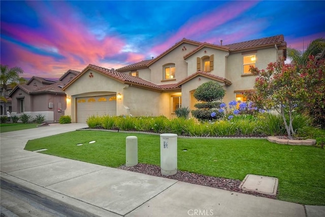3184 Toopal Dr, Oceanside, CA 92058 - mediterranean / spanish home with driveway, an attached garage, a yard, a tile roof, and stucco siding