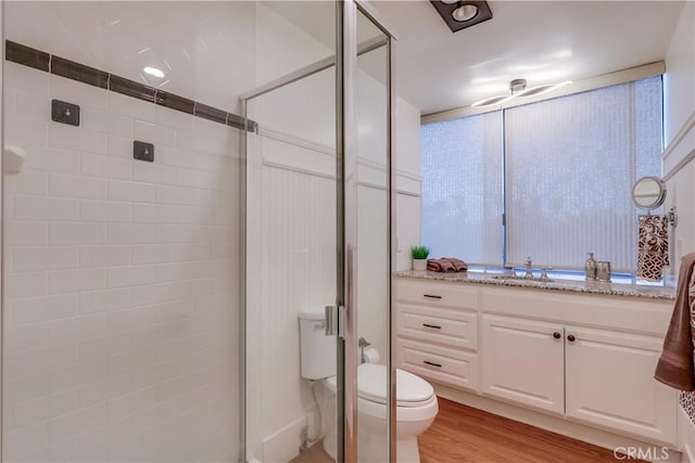 2999 E Ocean Blvd Unit 210, Long Beach, CA 90803 - full bath with toilet, a stall shower, vanity, and wood finished floors