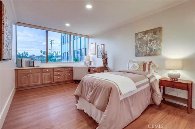 2999 E Ocean Blvd Unit 210, Long Beach, CA 90803 - bedroom featuring light wood-style floors, crown molding, recessed lighting, and baseboards