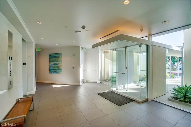 2999 E Ocean Blvd Unit 210, Long Beach, CA 90803 - tiled empty room with baseboards and recessed lighting